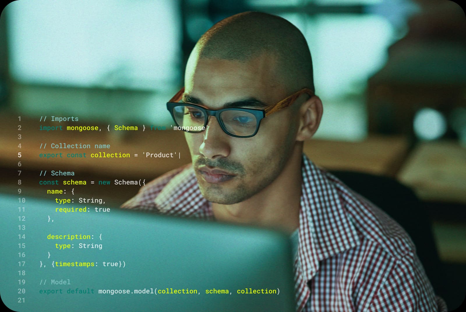 Developer wearing glasses, code editor reflected on screen