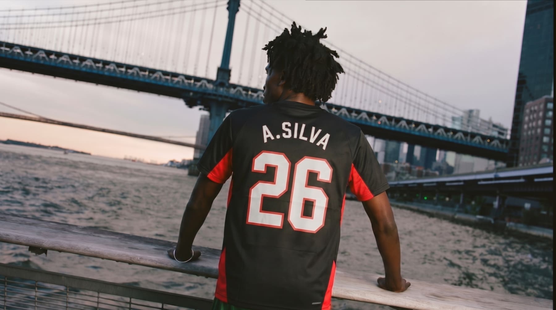 Player wearing the A. Silva jersey, back turned, overlooking the East River