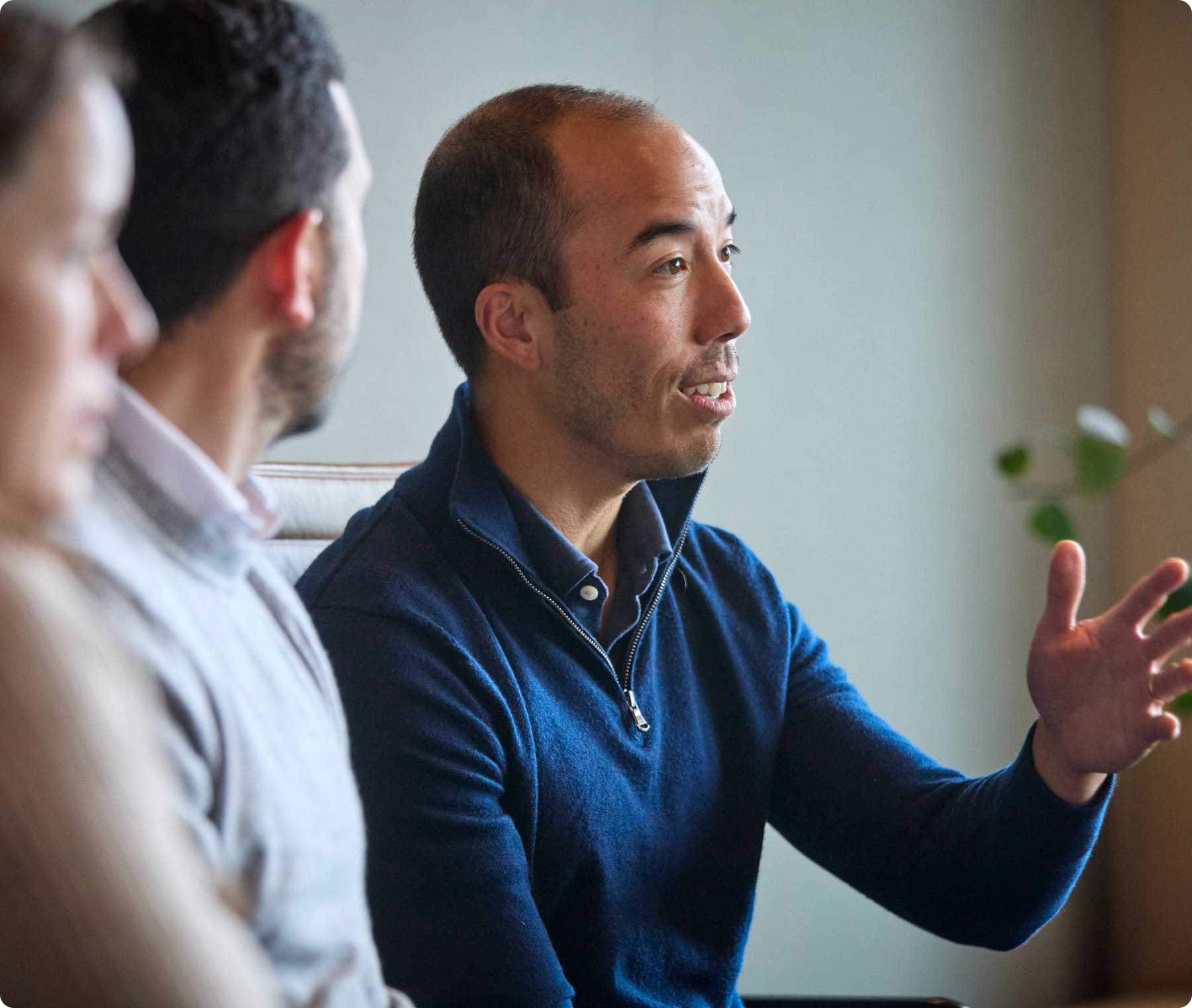 Photo of a Sixth Street team member in conversation